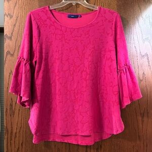 Pink on pink patterned top.